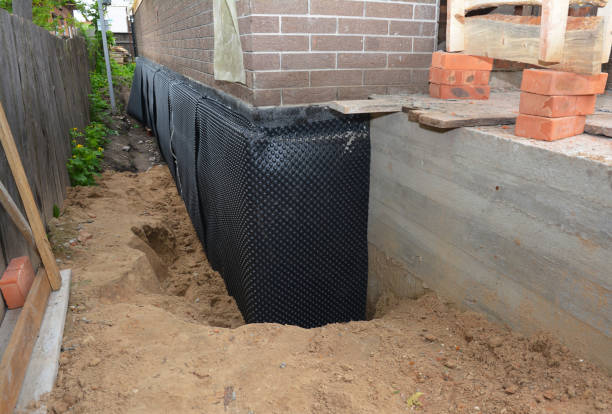 Happy homeowners after waterproofing job in Sewell